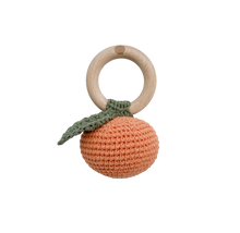 Load image into Gallery viewer, Crochete orange-shaped teething ring with a wooden ring on a light gray background