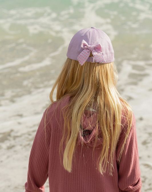 Girls rainbow unicorn embroidered bow baseball hat with colorful design and adjustable strap by bits and bows.