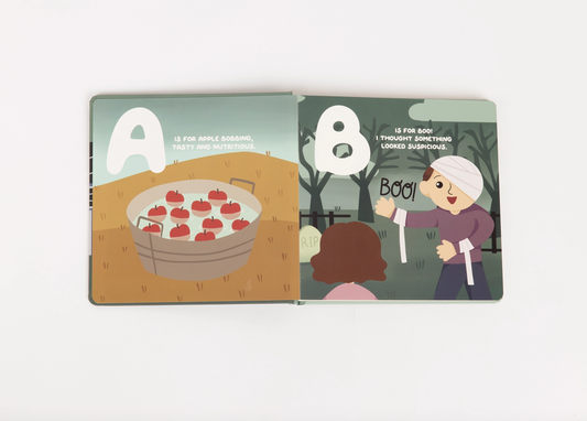 Halloween ABC trick-or-treat alphabet board book by Emerson and Friends, featuring colorful pages with spooky and fun Halloween-themed letters.