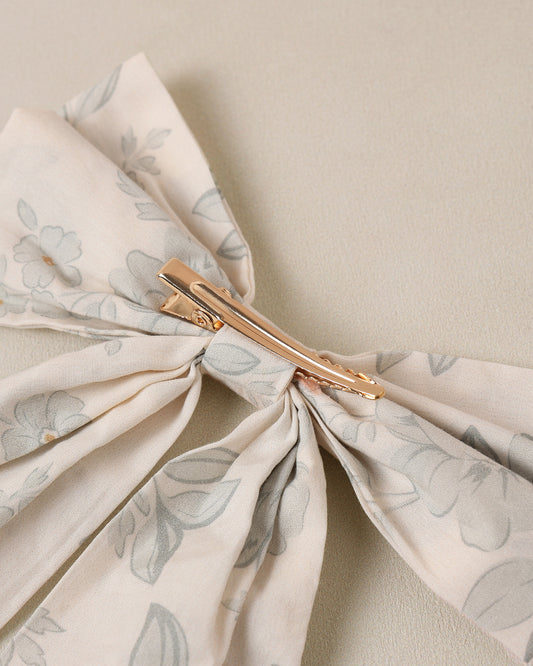 Noralee Everly Bow Mist in English Rose scent featuring a soft pink bow and floral packaging with rose design.