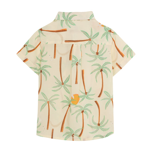Boy's Palmeras Guaybera button-down shirt from Pepita & Me, featuring a tropical palm leaf print in vibrant colors.