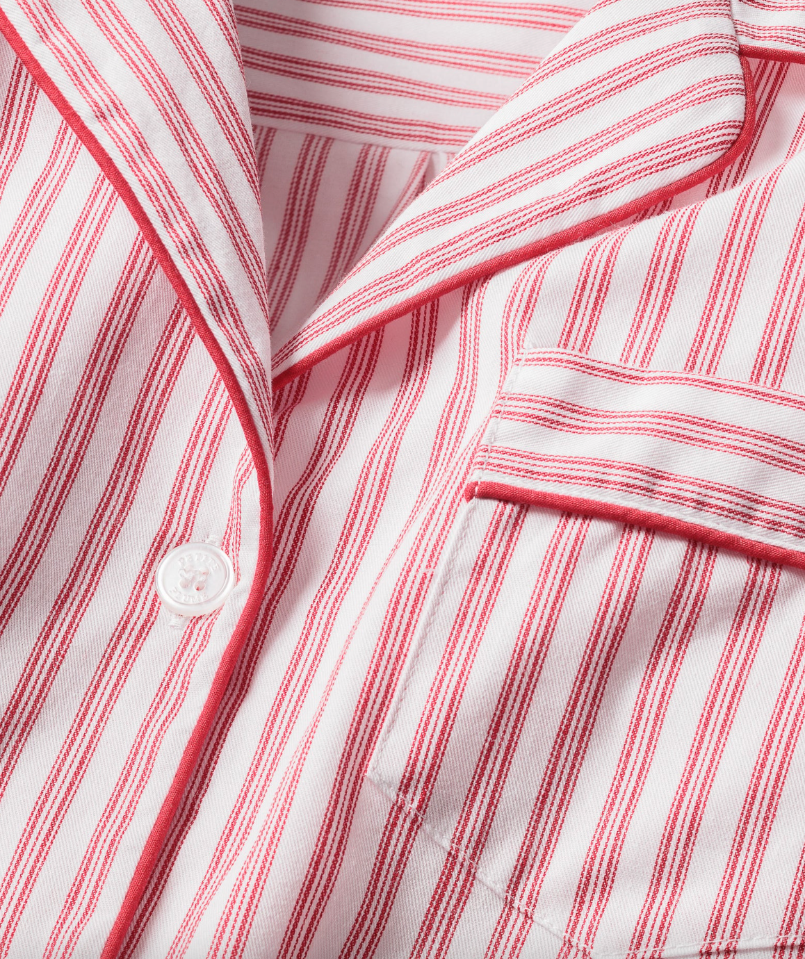 Kids antique red ticking pajama set by Petite Plume, featuring a cozy long-sleeve top and matching pants with classic ticking pattern.