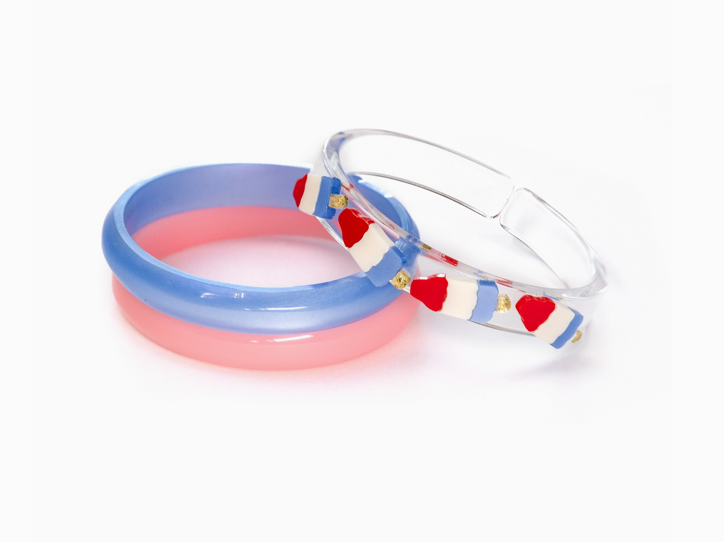 Red, white, and blue popsicle-shaped bangle bracelet by Sweet Wink, colorful accessory with a playful, summer-inspired design.