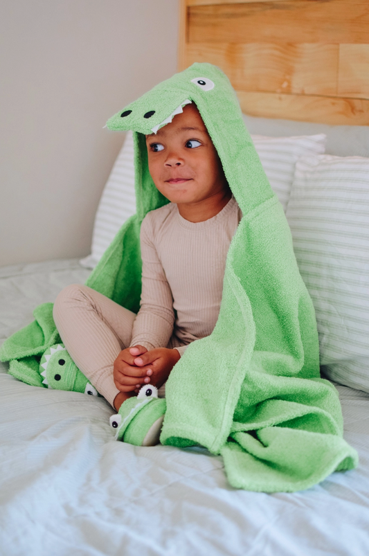 Kids Yikes Twins alligator hooded towel featuring a green alligator design and a cozy hood, perfect for bath time.