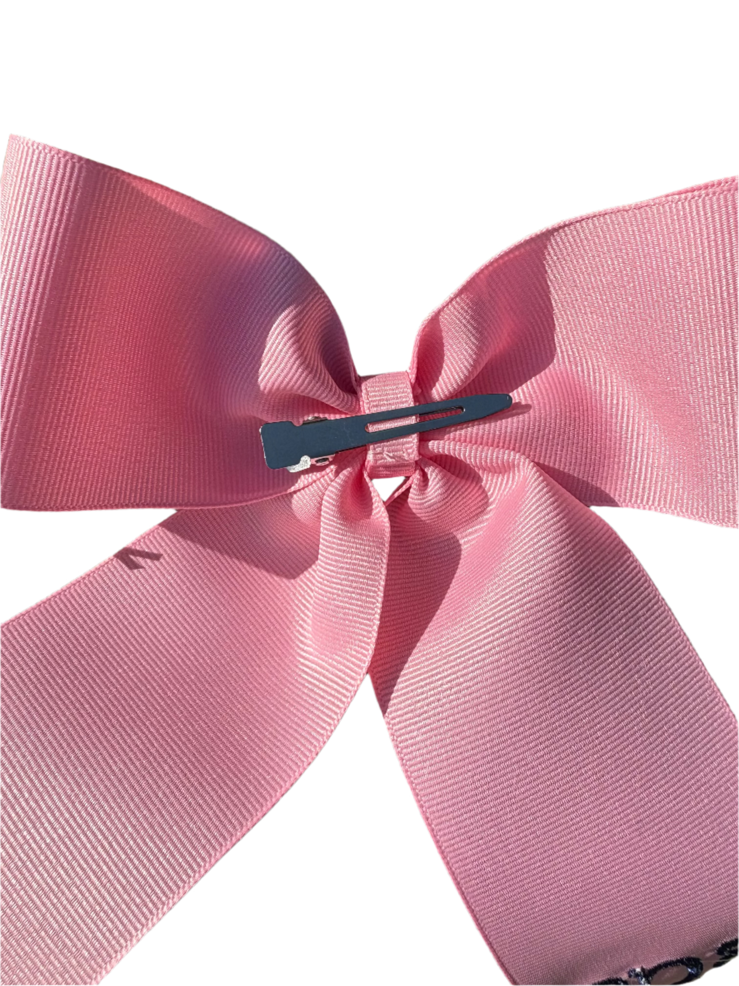 Large personalized embroidered bow with alligator clip by Flora Ottimer, featuring colorful floral embroidery and secure clip attachment.