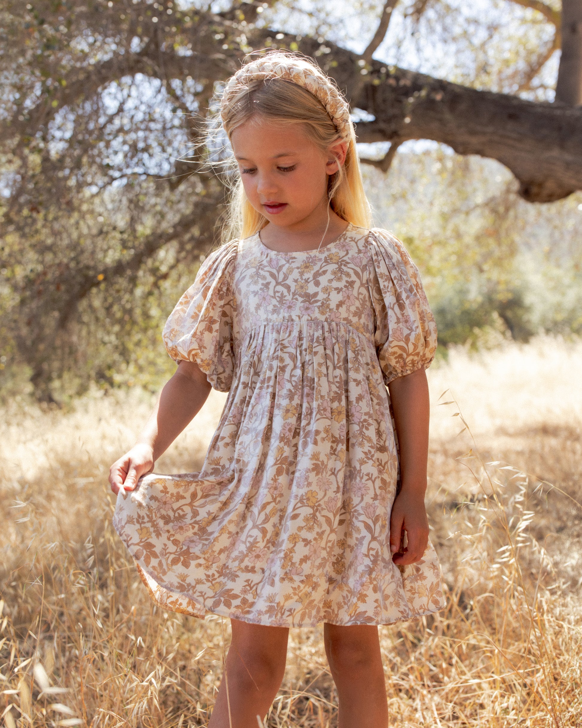 Girls shimmering Luna dress by Noralee with a vibrant wildflower print, featuring a flowing sleeveless design and delicate shimmer.