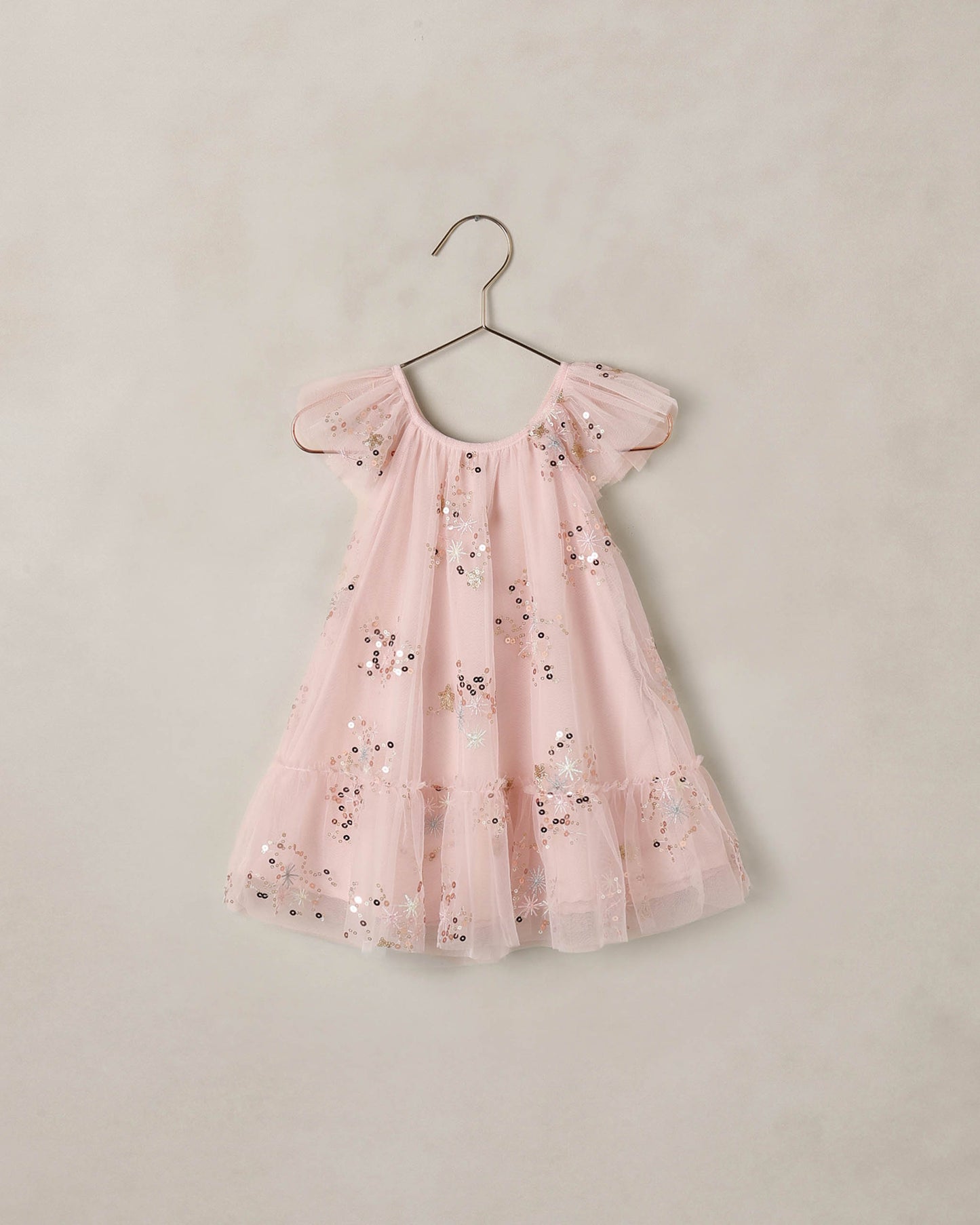 Girls Edie Dress in pink sparkle fabric by Noralee, featuring a stylish sleeveless design and shiny sequin details.