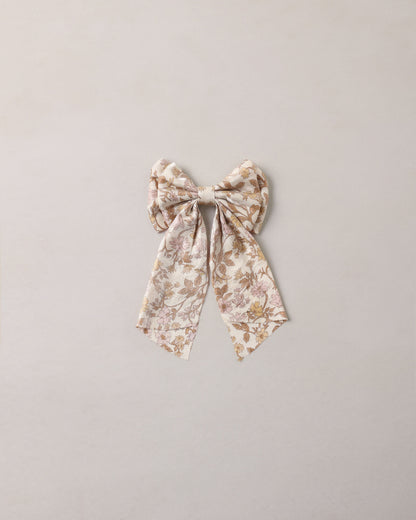 Noralee Alice Bow in Wildflower, natural fabric headband with a large floral bow design, styled for a charming, casual look.