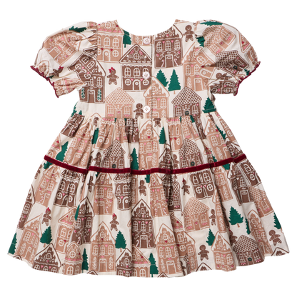 Girls Eliza Dress by Pink Chicken featuring a gingerbread house holiday print, with soft fabric and festive design for special occasions.
