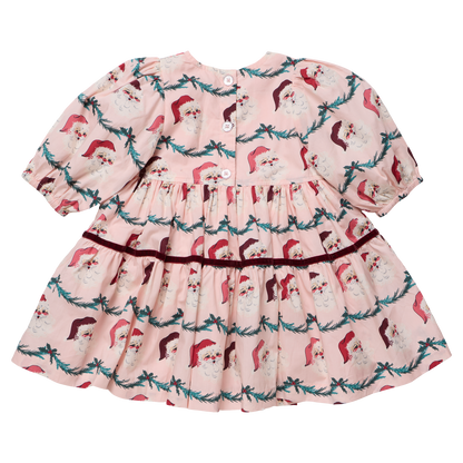 Girls Maribelle dress in Santa Garland pattern by Pink Chicken, featuring festive red and green holiday-themed floral design.