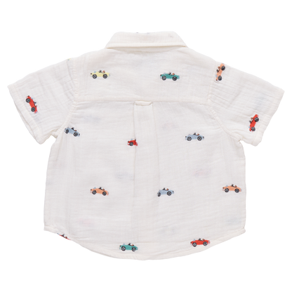 Boy wearing Pink Chicken vintage car embroidered button-down Jack shirt, featuring colorful car embroidery on soft fabric.