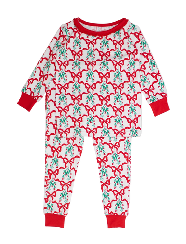 Children's pajama set with red bows and green leaves on a white background