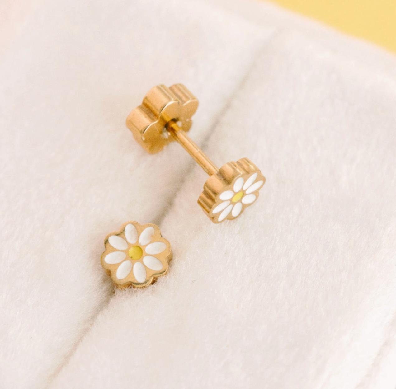 White Tiny Daisy Screw Back Earrings by Pierced Co showcasing delicate daisy design on sterling silver posts