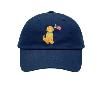 Navy blue cap with a embroidered dog holding an American flag on a white background