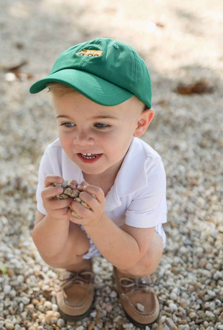 Kids embroidered green dump truck baseball hat by bits and bows, featuring colorful truck design and adjustable brim.