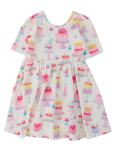 Load image into Gallery viewer, Children's dress with cake pattern on a white background
