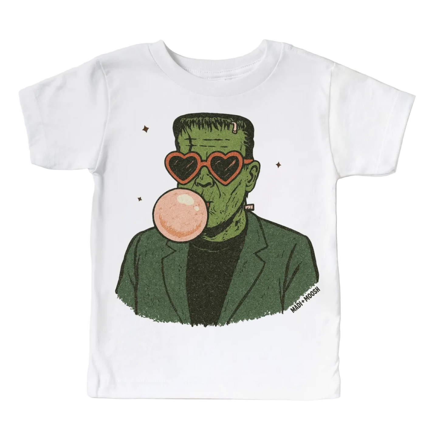 A white short-sleeve t-shirt with a graphic print of Frankenstein's monster wearing heart-shaped sunglasses and blowing a pink bubblegum bubble, on a light gray background.