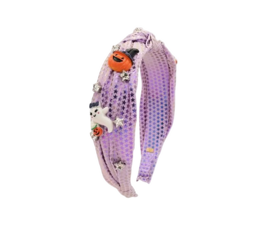 Bari Lynn Shining Star Halloween knotted headband featuring a star-shaped decoration on a black fabric band.