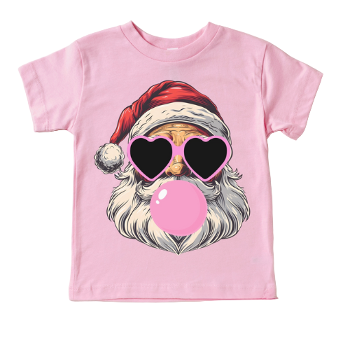 Pink t-shirt with a graphic of a Santa Claus-like character wearing sunglasses and blowing a bubble, on a light gray background.