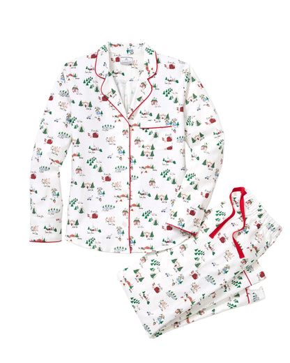 Women's twill pajama set in North Pole Chronicles by Petite Plume, featuring cozy pajama top and matching pants in festive print.