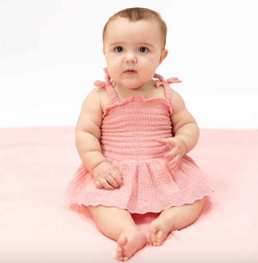 Angel Dear solid pink muslin smocked bubble with matching skirt, soft and breathable baby outfit, perfect for special occasions.