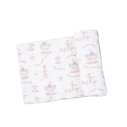 Angel Dear Carousel with Bows swaddle blanket featuring a soft fabric with colorful carousel and bow patterns for babies.