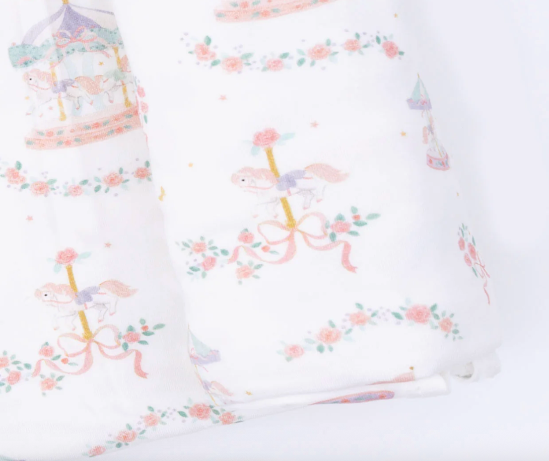 Angel Dear Carousel with Bows swaddle blanket featuring colorful carousel and bow patterns, soft and cozy for babies.