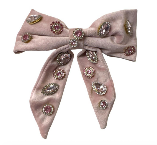 Pink jeweled velvet bow hair clip by Bari Lynn, featuring sparkling embellishments and a soft velvet texture.