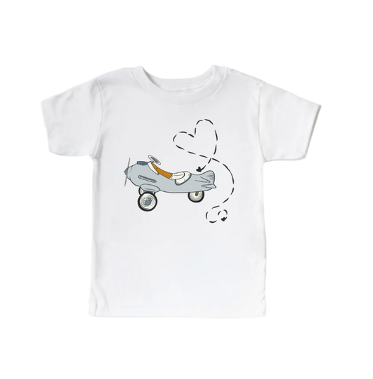 Kids' Valentine's Day shirt featuring airplane design and love-themed graphics from Benny & Ray Apparel.