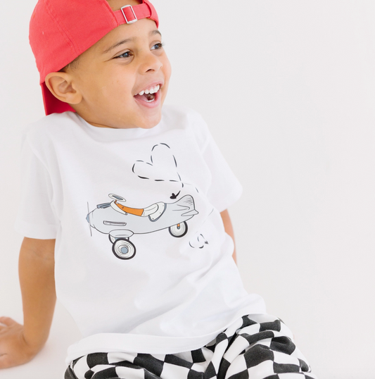 Kids' Valentine's Day shirt featuring an airplane design, from Benny & Ray Apparel, with "Love is in the Air" theme.