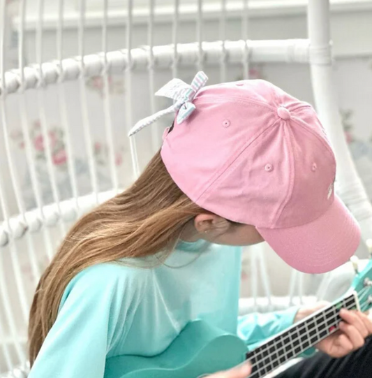 Embroidered rainbow bow baseball hat by bits and bows featuring colorful rainbow bow detail on classic cap style.