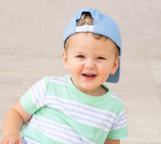Light blue kids' embroidered hockey baseball hat by Bits and Bows, featuring a sporty design and adjustable strap.