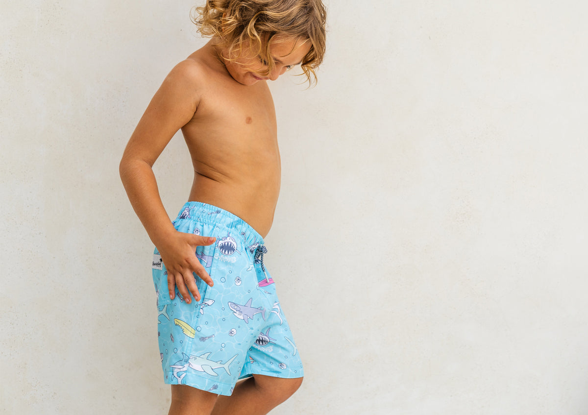 Kids' Boardies Sharky Waters swim shorts with shark pattern, lightweight and quick-drying for boys and girls.