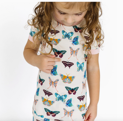 Emerson and Friends Wings of Paradise butterflies two-piece bamboo kids pajama set with short sleeves and pants, colorful butterfly print.