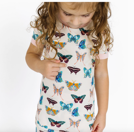 Kids' bamboo short sleeve pajama set with butterfly wings of paradise print from Emerson and Friends, featuring colorful butterfly designs.