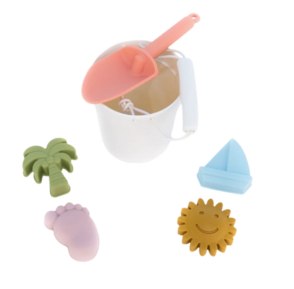 Silicone beach bucket and toy set by Emerson and Friends with colorful shovels, molds, and play accessories for kids.