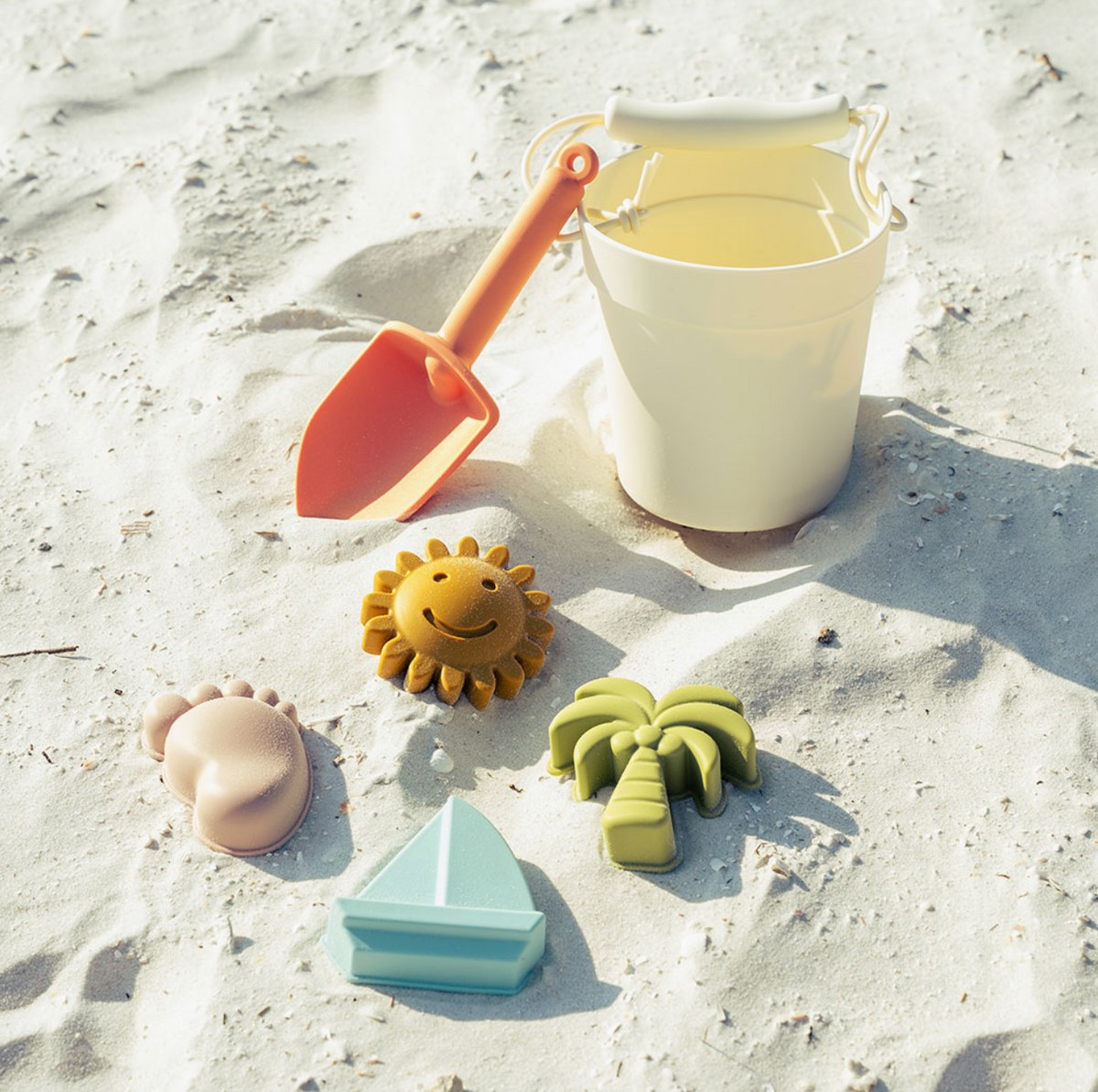 Colorful silicone beach bucket and toy set from Emerson and Friends, perfect for sandcastle building and seaside play.