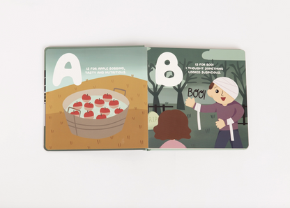 Halloween ABC trick-or-treat alphabet board book by Emerson and Friends, featuring colorful pages with spooky and fun Halloween-themed letters.