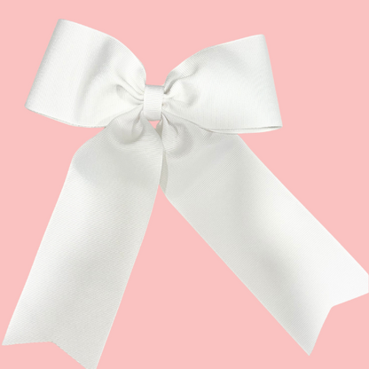 Large personalized embroidered bow with alligator clip by Flora Ottimer, featuring vibrant red fabric and intricate embroidery detail.