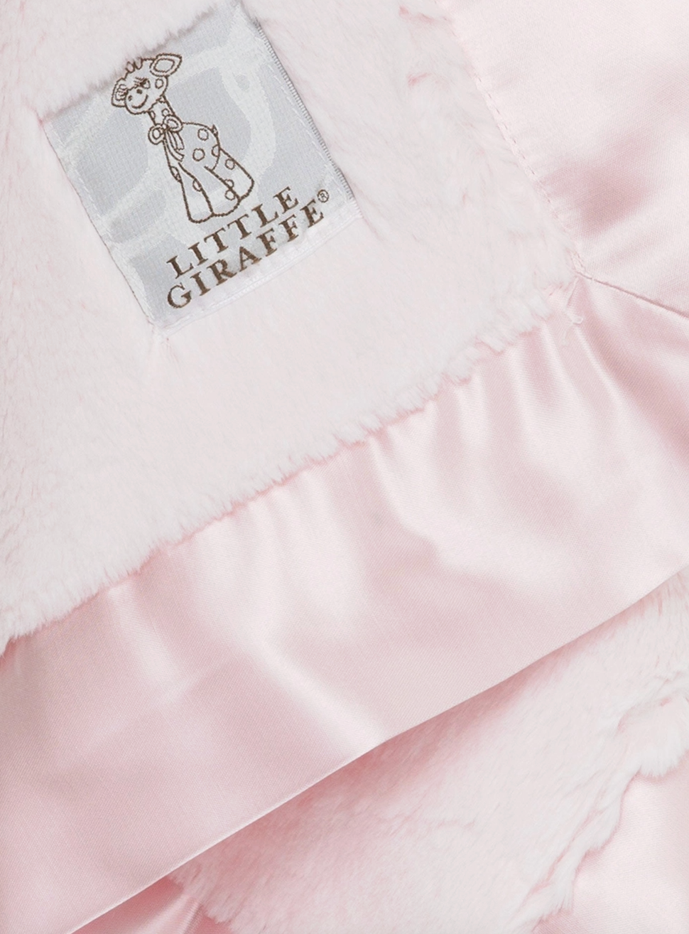 Little Giraffe Luxe Blanky in pink, soft plush baby blanket with a smooth texture and gentle pastel hue.