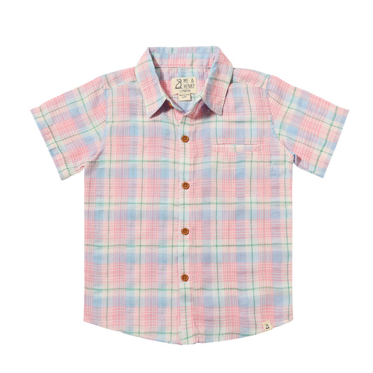 Boy wearing a navy Newport Woven Button Down shirt by Me & Henry, with a classic collar and woven fabric detail.