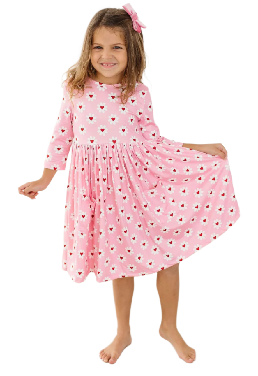 Mila and Rose Daisy Delight girls' pink pocket twirl dress with floral pattern, perfect for Valentine's Day, front view.