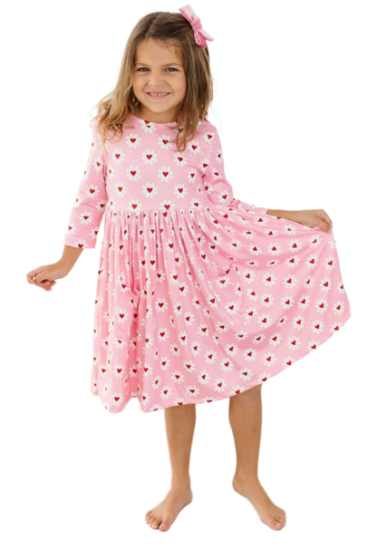 Mila and Rose Daisy Delight girls' pink pocket twirl dress with floral pattern, perfect for Valentine's Day, front view.