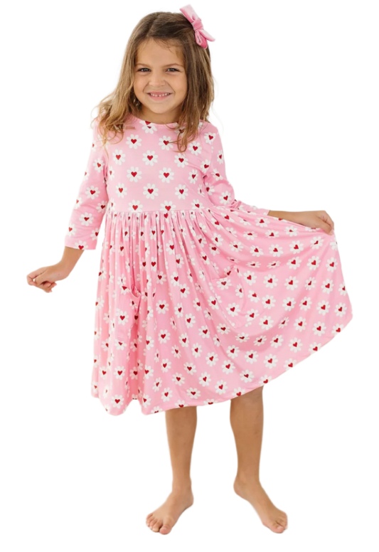 Mila and Rose Daisy Delight girls' pink pocket twirl dress with floral pattern, perfect for Valentine's Day, front view.