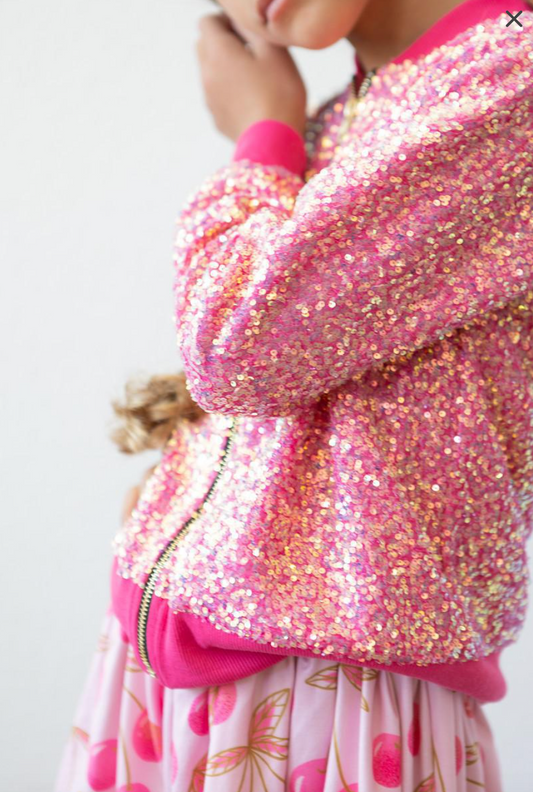 Hot pink sequin jacket by Mila and Rose, shown with shimmering sequins and a stylish fit on a model.