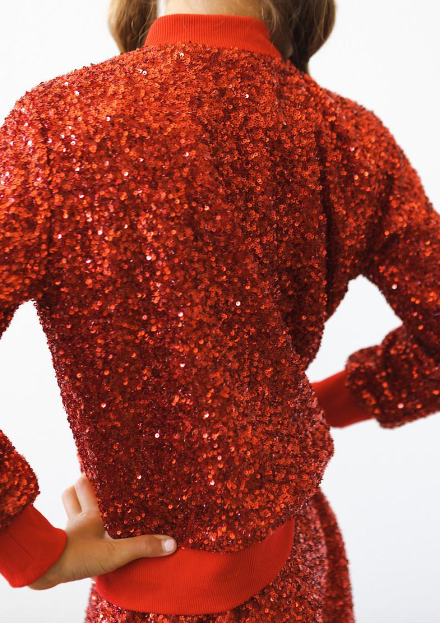 Red sequin jacket for toddlers by Mila and Rose, shiny fabric with a stylish design perfect for festive occasions.