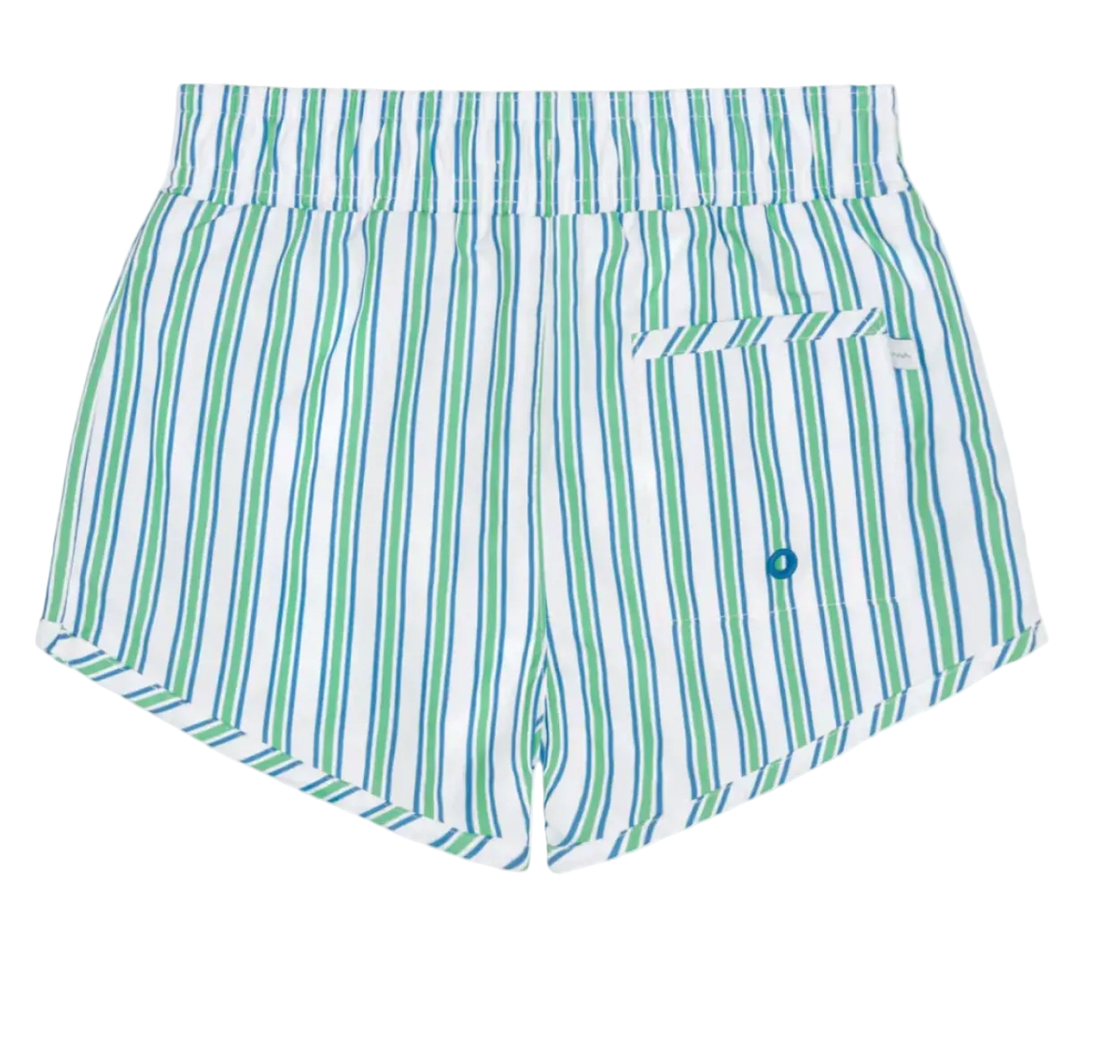 Boy wearing Minnow Tamarin Stripe boardie with blue and white stripes, standing on the beach in sunny weather.