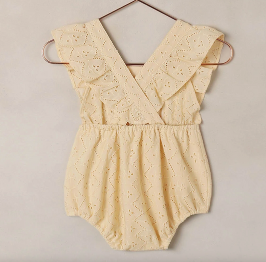 Baby Lucy Eyelet Lemon Romper by Noralee, featuring delicate eyelet fabric and a bright lemon color, perfect for summer outings.