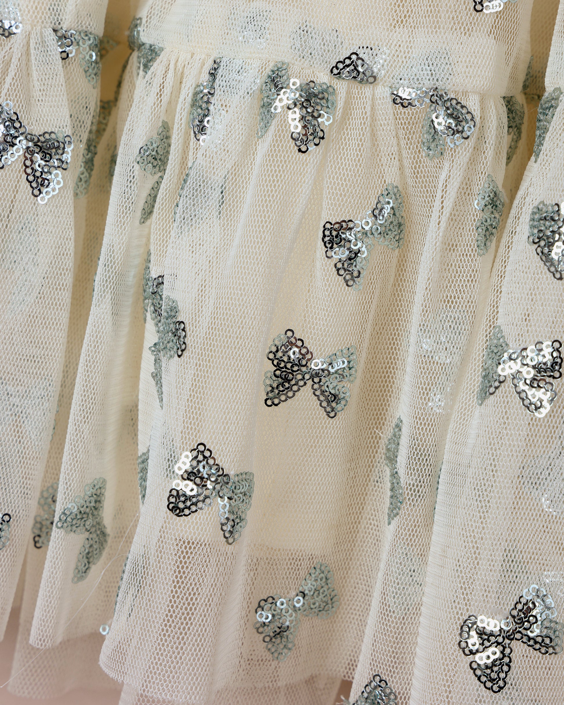 Noralee Louella dress with sequin bows in natural fabric, featuring elegant design and decorative bow details.