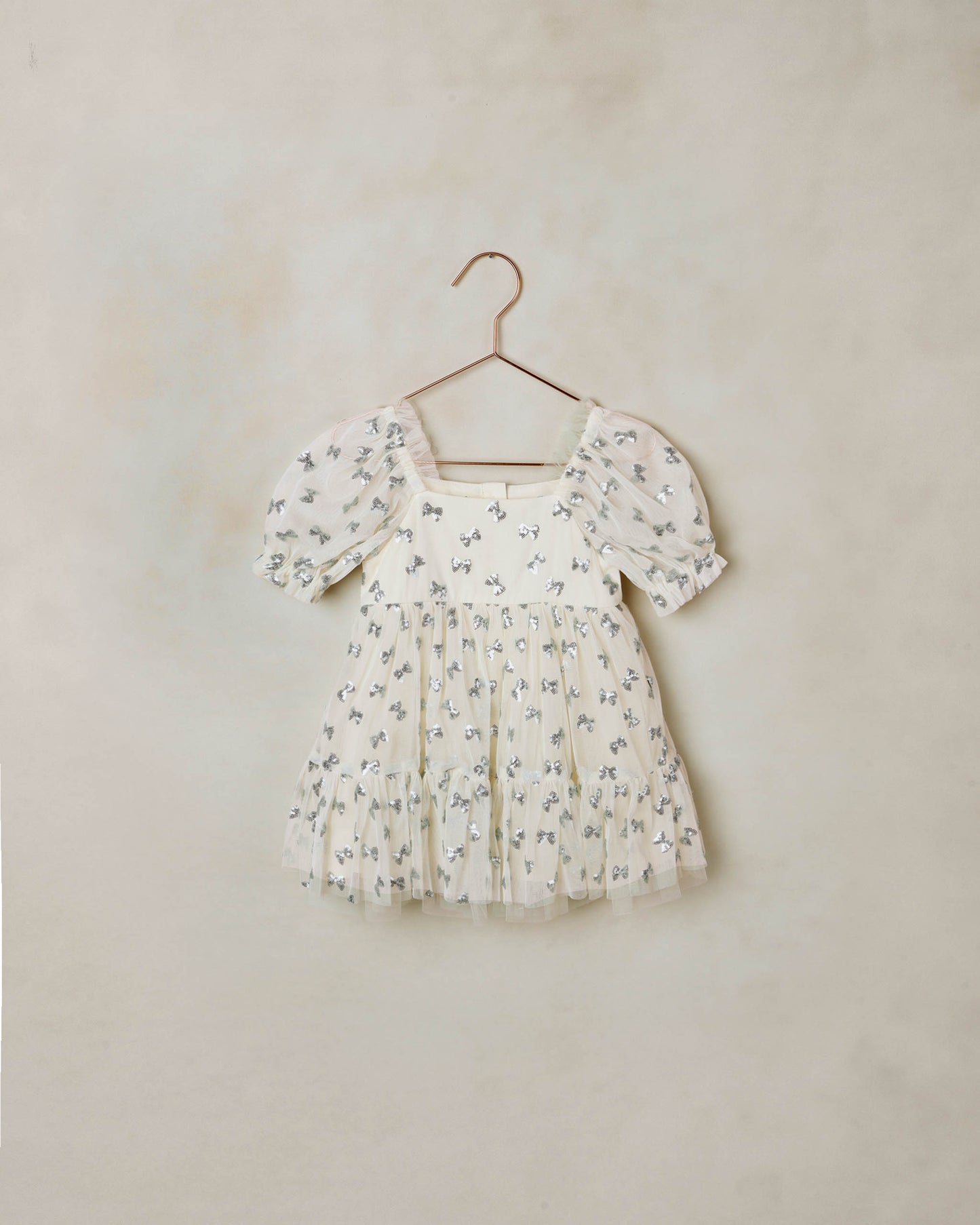 Noralee Louella Dress with sequin bows in natural color, featuring a stylish design and decorative sequins on the front.